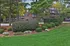 Exterior Brick Apt Building with Balconies and Patio, and landscaping