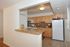 Kitchen with updated white appliances, gas range, dishwasher, frost free fridge