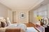 Bedroom with hardwood floors, 2 closets along the wall