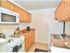 Galley Kitchen with updated white appliances, Gas range, dishwasher, and Frost free fridge