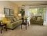 Living room with wall to wall carpet and walk out patio