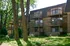 Exterior Brick Apt Building with Balconies and Patio
