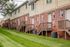 exterior brick townhome. back of townhome