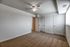 Bedroom with wall to wall carpet, closet along the wall