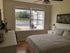 bedroom with large Windows