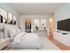 hardwood floored bedroom with full bath and walk in closet