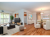 Living/Dining room with hardwood floors, balcony