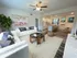 Living/DIning Room, hardwood flooring, kitchen w/Island, ceiling fan