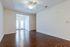 Wood Floors. Ceiling Fan. Spacious room with alcove.