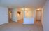 living room and dining room with wall-to-wall carpet