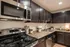 Kitchen. Stainless Steel Appliances. Espresso Cabinetry.