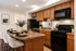 Kitchen with large island and black appliances
