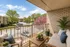 Balcony with seating, a table, and plants
