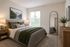 Primary bedroom with lots of natural light