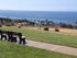 A bench on a hill overlooking several houses, the beach, and the ocean. | Rental Houses | Los Angeles AFB | Los Angeles, CA