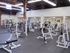 A large fitness center with several different types of blue and white fitness equipment. Rental Houses near Los Angeles AFB | Los Angeles, CA