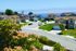 A cul-de-sac with several two-story houses and varying colors. The cul-de-sac overlooks the ocean. | Homes for rent near Los Angeles AFB