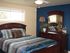 Interior decorated bedroom | blue comforter | base housing model home | Warm bedroom decorating