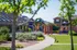 A children's playground with red, yellow, and blue equipment near a dog park. | Pet-friendly rental houses, Schriever SFB, Colorado Springs CO