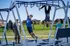 family playing on outdoor gym