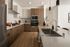 Modern kitchen with sleek cabinetry, stainless steel appliances, and elegant lighting.