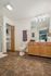 Elegant bathroom with modern lighting, spacious vanity, and wood accents, offering a luxurious feel.
