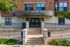 Inviting entrance to Library Hill Apartments with landscaped greenery and modern architecture.