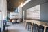 Modern lounge area with chic seating, contemporary decor, and high ceilings for a stylish and inviting atmosphere.