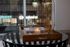 Chic apartment setting with a glass of wine and candle on a stylish coffee table, creating a cozy ambiance for relaxing evenings.