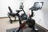 Modern fitness room featuring a high-tech Peloton bike and exercise equipment, perfect for home workouts.