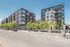 Contemporary urban apartment complex with modern architecture, large windows, and landscaped surroundings. Ideal city living with abundant natural light and sleek design.