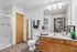 Modern bathroom featuring sleek fixtures, a spacious countertop with elegant decor, and a separate shower stall for a luxurious feel.