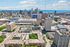 Vibrant aerial view of downtown Milwaukee showcasing modern architecture, lush greenery, and the serene lakefront.