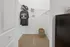 Spacious walk-in closet with sleek shelving, cozy carpeting, and ample storage space.