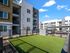 Pet-Friendly Apartments in Glendale, AZ - Acero at the Stadium - Dog Park With Grass, a Bench, and a Fence