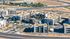 Apartments In Queen Creek, AZ For Rent - Acero Harvest Station - Aerial View Of The Entire Property Featuring Multiple Housing Buildings And The Leasing Office Right In The Center In Front Of The Pool Area