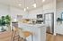 2 Bedroom Apartments in Vancouver, WA - Bennington on First - Kitchen - Stainless Steel Appliances - Quartz Countertops - Wood-Style Flooring - White Cabinets