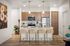 Pet-Friendly Luxury Apartments in Eastmark AZ - Acero Hawes Crossing - Modern, Bright Kitchen with Quartz Countertops, Stainless Steel Appliances, Wood-Patterned Cabinetry, Cooking Island, White Tile Backsplash, and Stool Seating