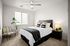 Eastmark, AZ, Apartments Near Mesa Gateway - Acero Hawes Crossing - Modern Bedroom With Ceiling Fan, Window Blinds, Upholstered Headboard, And Nightstand Lighting.