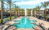 Pet-Friendly Apartments in Goodyear, AZ - Acero Roosevelt - Swimming Pool with Lounge Chairs, Cabanas, and Manicured Landscaping