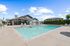 Apartments In Vancouver, WA For Rent - Acero Jensen Park - Sparkling Swimming Pool With Hot Tub, Chairs, And Surrounded By Grass
