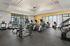 Dog-Friendly Apartments in Vancouver, WA - Bennington on First - Fitness Center with Free Weights, Elliptical Machines, Treadmills, Stationary Bikes, Floor-to-Ceiling Windows, and Ceiling Fan