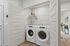 Vancouver, WA Apartments - Bennington on First - Washer & Dryer Inside A Closet With A Storage Rack