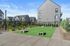 3 BR Apartments In Vancouver, WA - Bennington on First - Cornhole Game Area With Chairs And Outdoor Lights