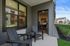 2 BR Apartments in Vancouver, WA - Bennington on First - Exterior View of Building with Parking Lot, Trees, and Landscaping.