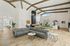 Luxurious open-concept living space featuring a stylish gray sectional, modern lighting, and a sleek pool table, perfect for entertaining.