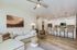 Inviting open-concept living room with stylish decor, modern kitchen, and comfortable seating, perfect for relaxation and entertaining.