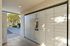 Modern package locker system in a well-lit, secure apartment complex entryway, providing convenience and safety for residents.