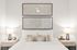 Elegant bedroom showcasing a modern bed with crisp white linens, flanked by stylish bedside tables with matching lamps, and adorned with sophisticated geometric wall art.