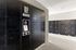 Modern package concierge area with sleek black lockers providing secure and convenient parcel storage.